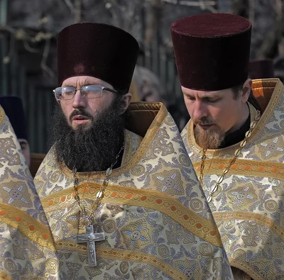 Pectoral crosses over the vestments and kamilavkas on the heads: clergy at a cross procession, 2010
