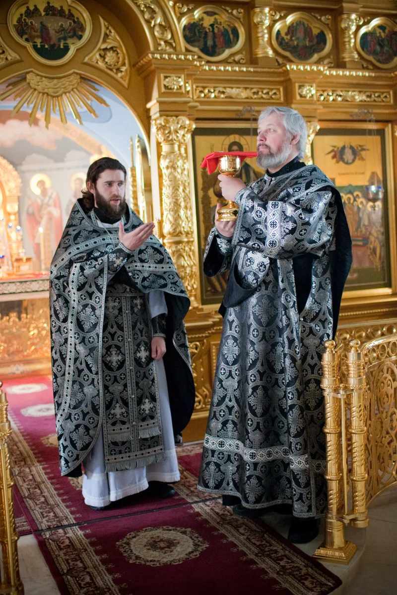 Black Lenten vestments: a priest with a veiled vessel in the sanctuary. Holy Trinity Cathedral, 2010