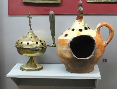 A katzion — the hand censer with a handle instead of chains — beside an earthenware one. Shilovo Museum