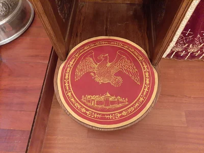 The rug spread on the church floor where the bishop will stand