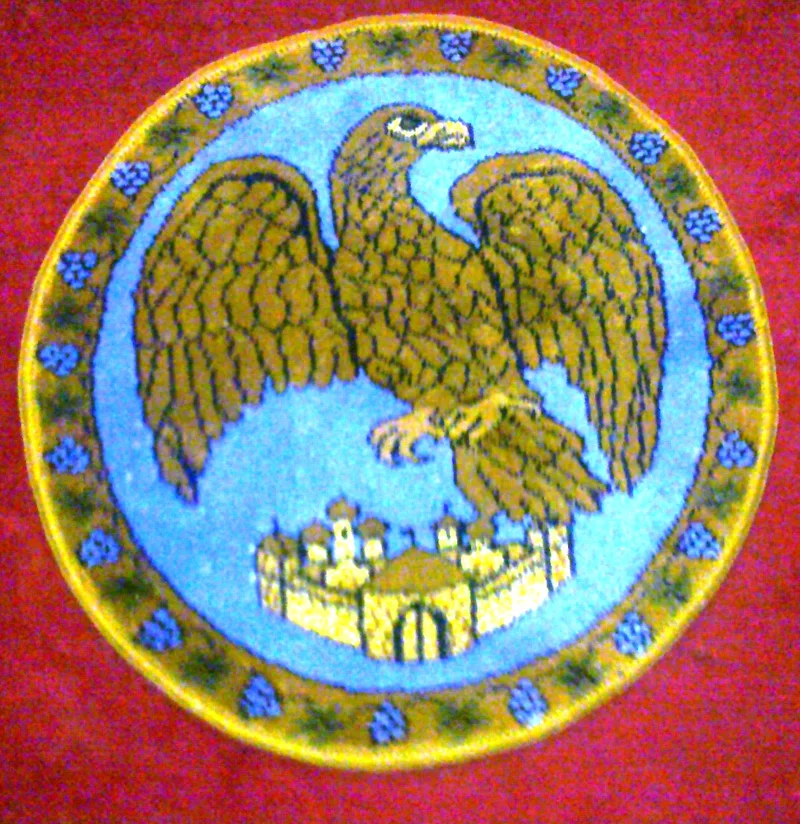 The whole design: a single-headed eagle soaring above city walls