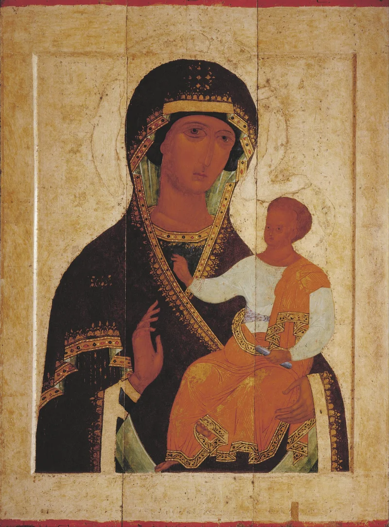Одигитрия письма Дионисия, около 1502 года: Младенец сидит прямо и благословляет, Богородица указывает на Него рукой у груди. Русский музей