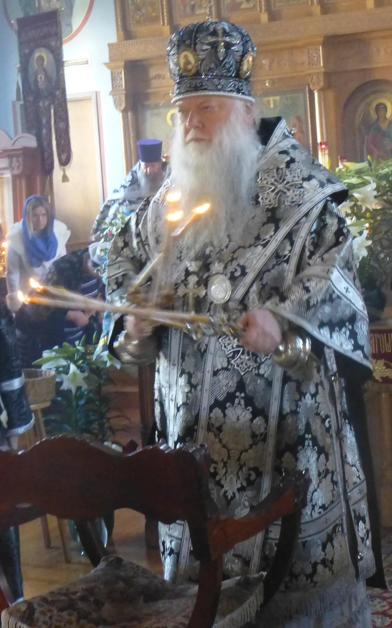 Omophorion on the shoulders, panagia and cross on the breast, dikirion and trikirion in hand: blessing right after vesting, 2008