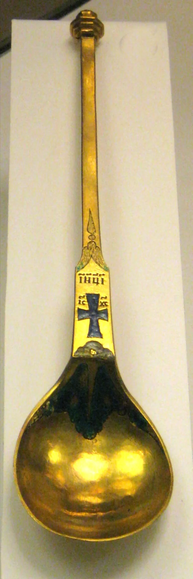 Long handle with an enamel cross and a deep bowl. Russia, late 17th – early 18th century