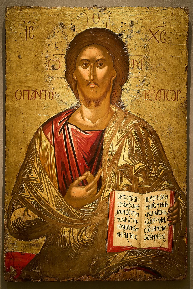 IC XC beside the head, Ο ΩΝ on the arms of the cross in the halo, Ο ΠΑΝΤΟΚΡΑΤΩΡ and the text of the open Gospel. Icon by Michael Damaskenos, second half of the 16th century, Athens